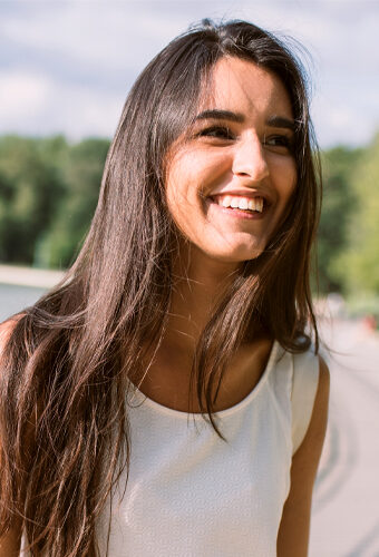 Woman smiling after great oral habits